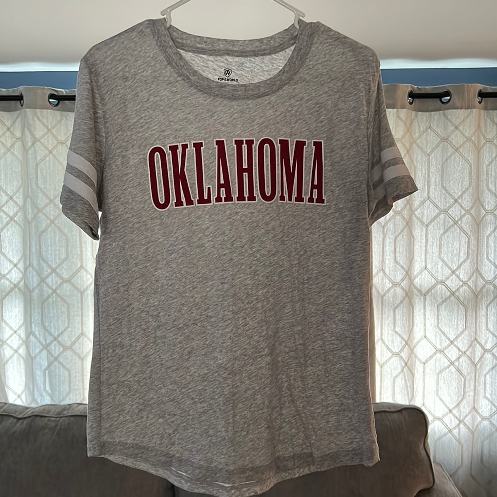 Never worn, no holes, no stains. Sports tee.